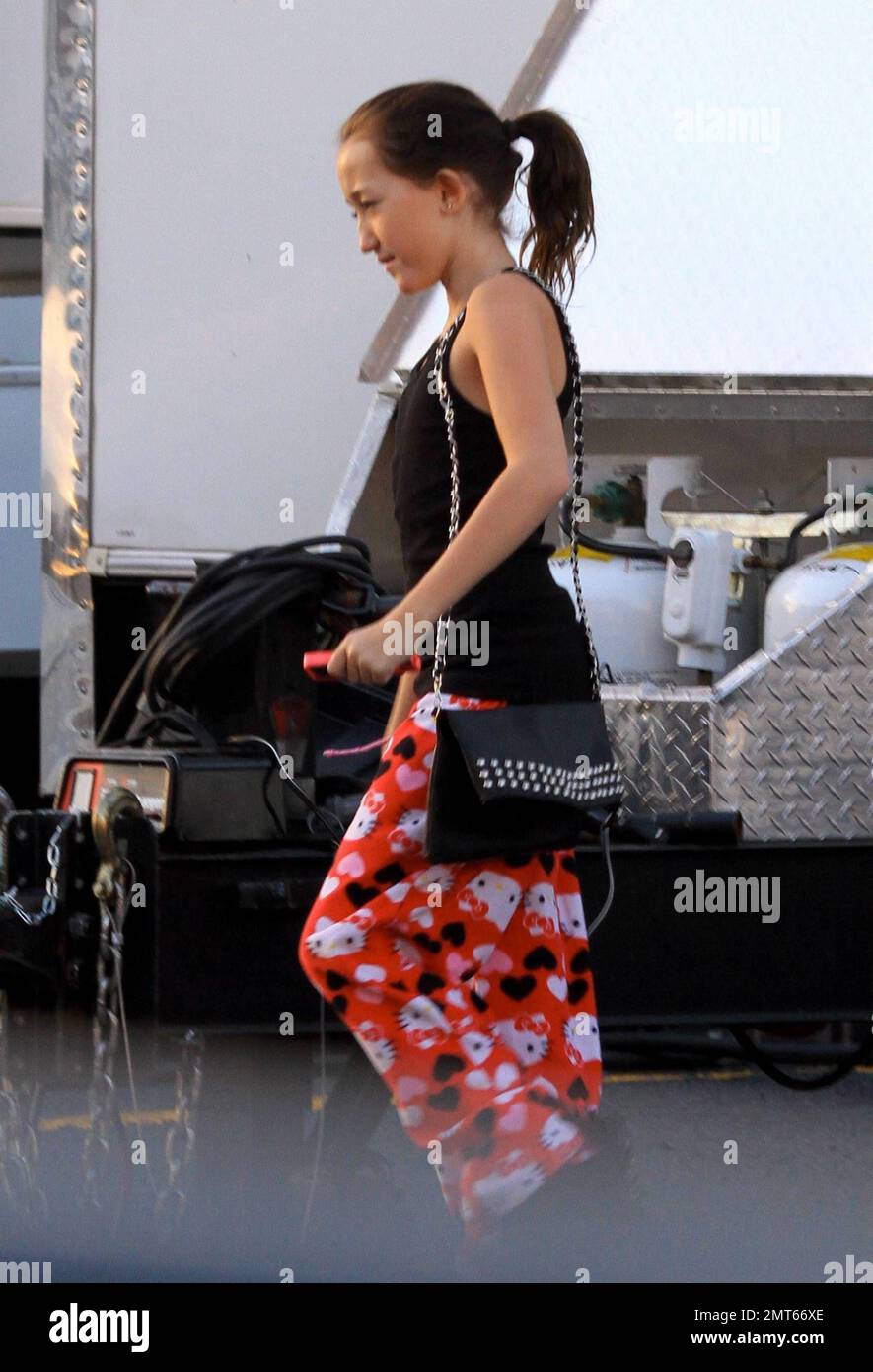 EXCLUSIVE!! Miley Cyrus' sister Noah looks cute in some pink Hello Kitty  pants and a black tank top as she visits her big sister on the set of So  Undercover. Carrying a large purse, Noah looked to be having fun as she  ran around the set. New Orleans, LA