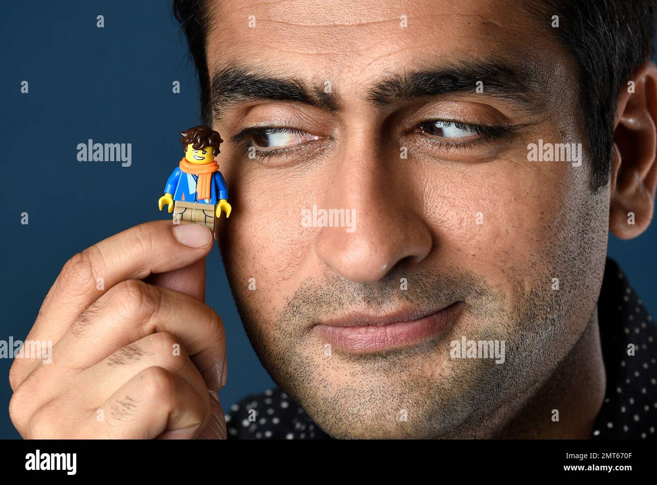 Kumail Nanjiani holds his Lego figurine as he poses for a portrait to promote the film The LEGO Ninjago Movie on day two of Comic Con International on Friday July 21 2017 in