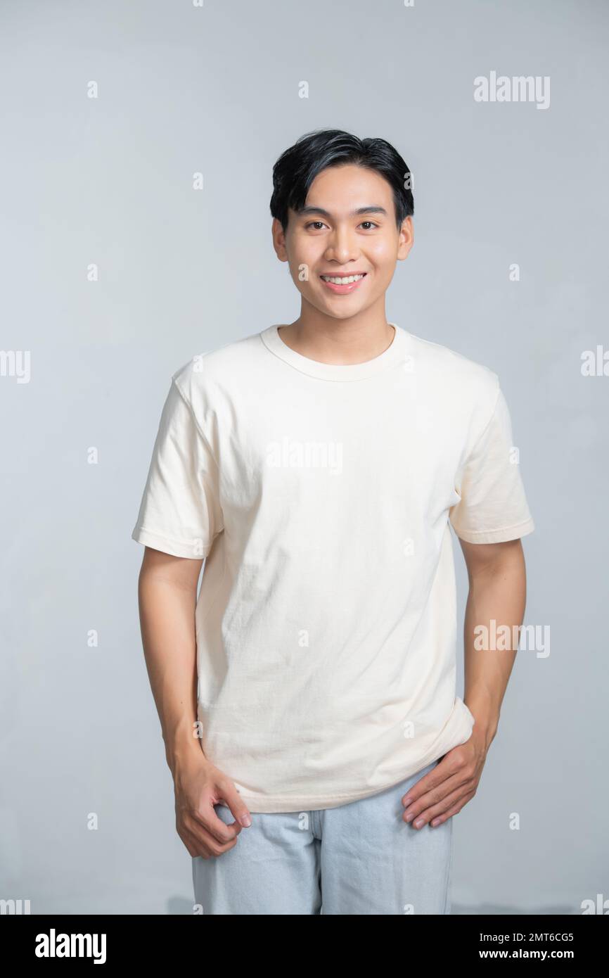 Closeup portrait of asia middle age 20s man wearing white shirt in studio Stock Photo