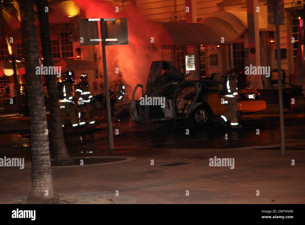 General views of a taxi that lit on fire on the famed Ocean Drive