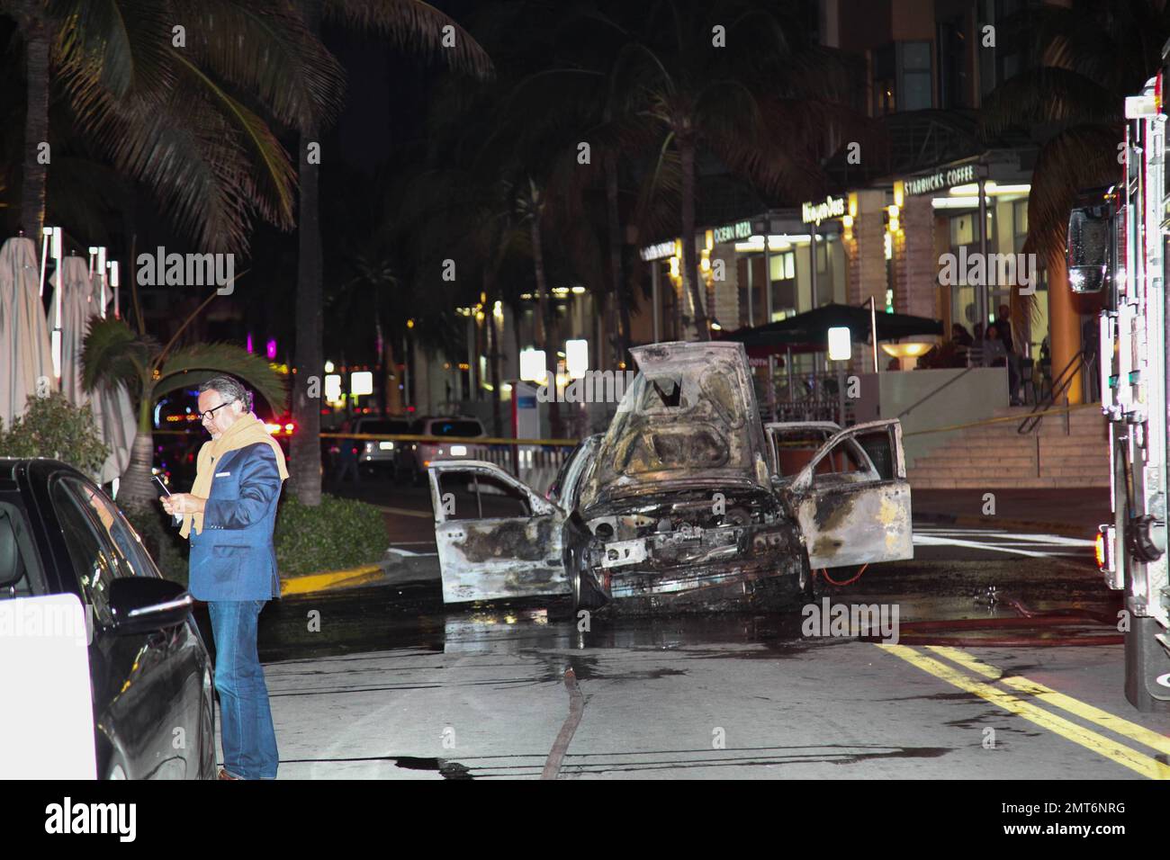 General views of a taxi that lit on fire on the famed Ocean Drive