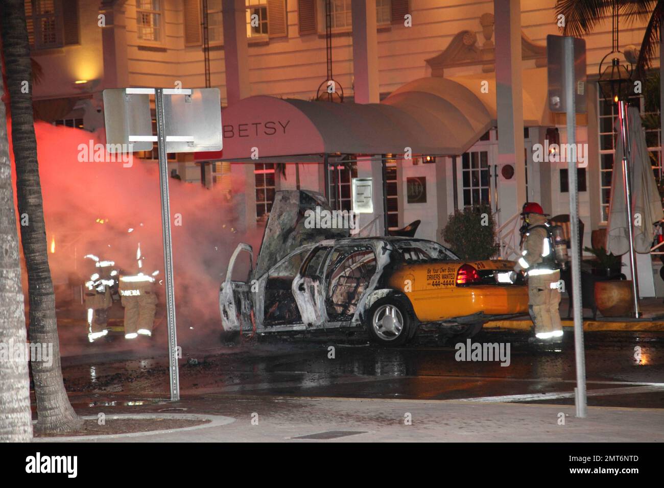 General views of a taxi that lit on fire on the famed Ocean Drive