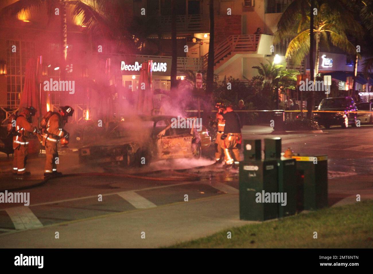 General views of a taxi that lit on fire on the famed Ocean Drive