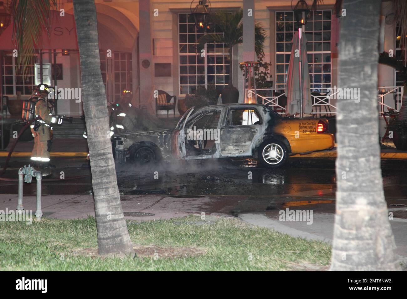 General views of a taxi that lit on fire on the famed Ocean Drive