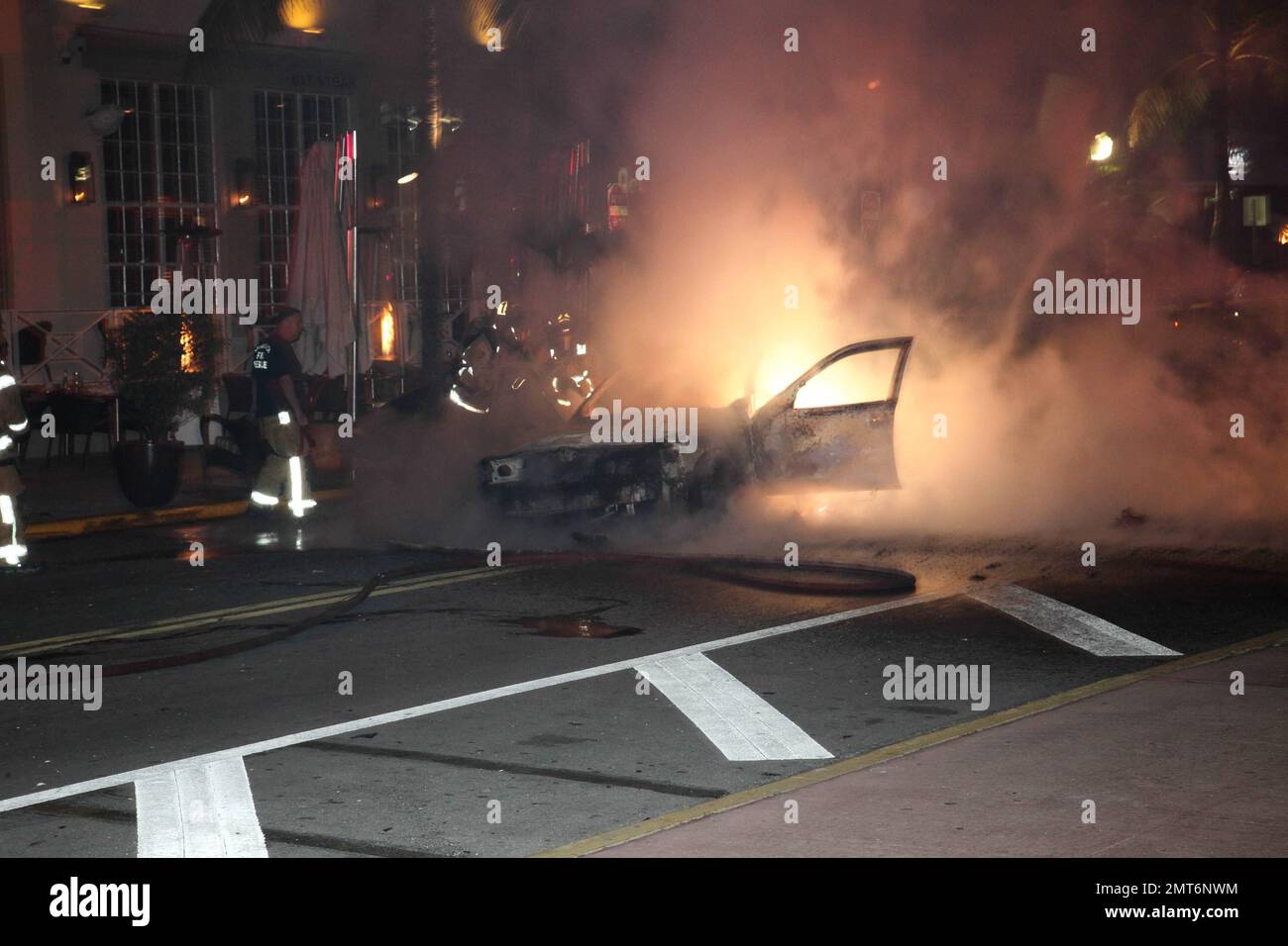 General views of a taxi that lit on fire on the famed Ocean Drive