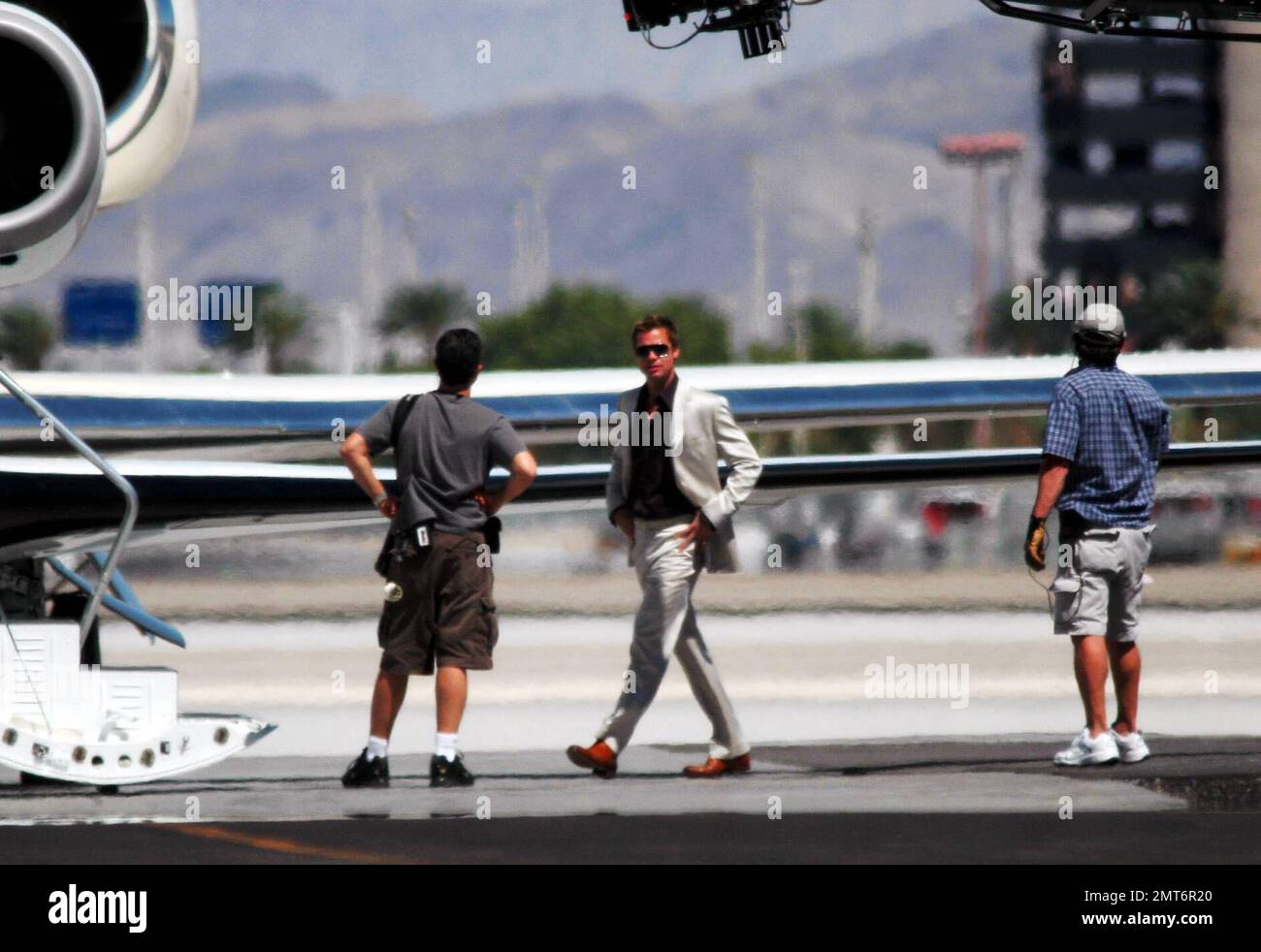 The boys are together again. Brad Pitt, George Clooney and Matt Damon were reunited on the Ocean's Thirteen set in Las Vegas, NV on Monday. The power trio were filming scenes at a local airport and made time in between takes to laugh and joke with eachother. The cast had to contend with soaring temperatures in excess of 110 degrees. 8/7/06 Stock Photo