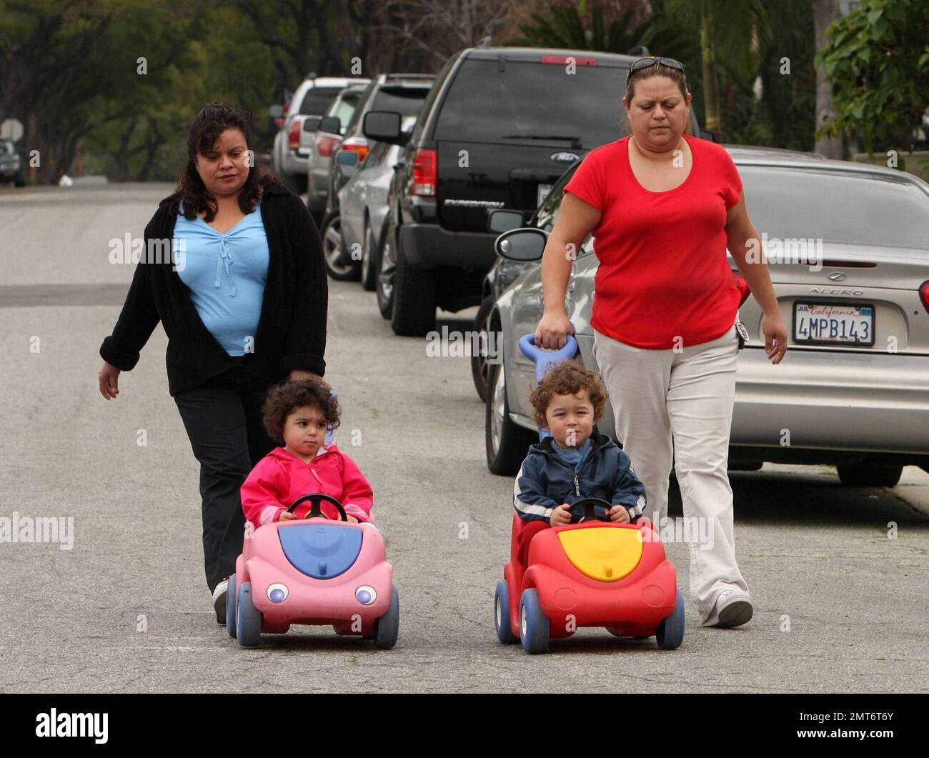 Nadya Suleman, aka Octomom, and her family start the day at home in Whittier, CA.  Nadya was seen sayng goodbye to one of her daughters as her Father, Ed Suleman, brought her out to meet the school bus.  Later in the morning the nannies were seen taking two of Nadya's fourteen children out for a morning stroll.  Nadya gave birth to octuplets on January 26, 2009.  Los Angeles, CA. 3/11/09. Stock Photo