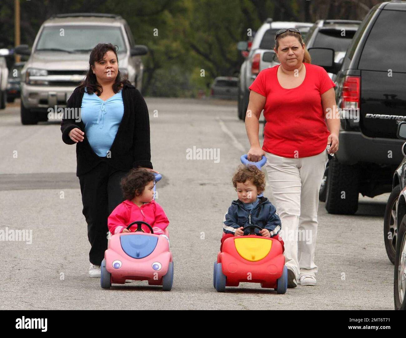 Nadya Suleman, aka Octomom, and her family start the day at home in Whittier, CA.  Nadya was seen sayng goodbye to one of her daughters as her Father, Ed Suleman, brought her out to meet the school bus.  Later in the morning the nannies were seen taking two of Nadya's fourteen children out for a morning stroll.  Nadya gave birth to octuplets on January 26, 2009.  Los Angeles, CA. 3/11/09. Stock Photo