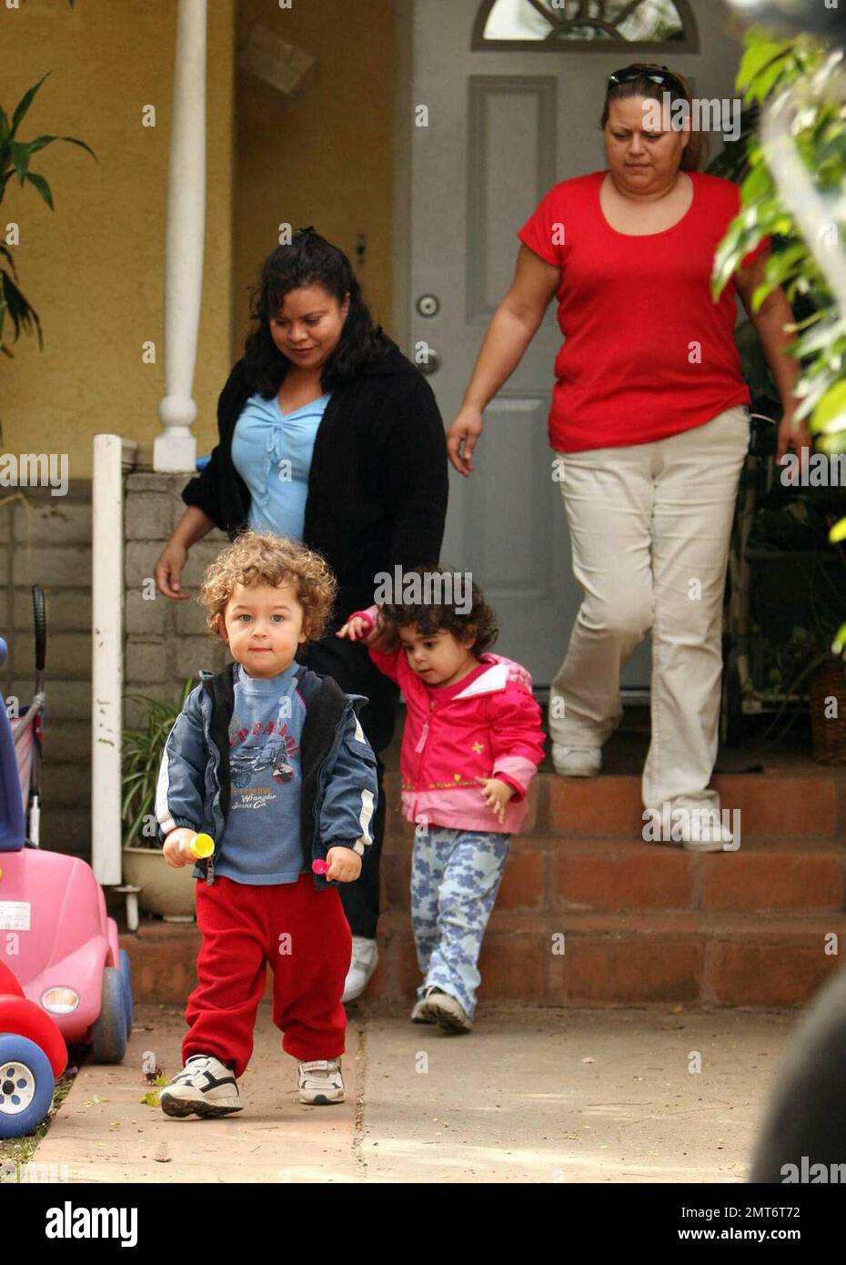 Nadya Suleman, aka Octomom, and her family start the day at home in Whittier, CA.  Nadya was seen sayng goodbye to one of her daughters as her Father, Ed Suleman, brought her out to meet the school bus.  Later in the morning the nannies were seen taking two of Nadya's fourteen children out for a morning stroll.  Nadya gave birth to octuplets on January 26, 2009.  Los Angeles, CA. 3/11/09. Stock Photo