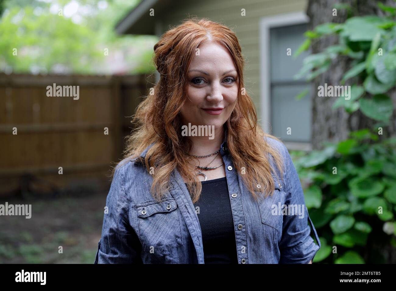 FILE - In this May 23, 2017, file photo, Dawn Erin poses for a photo at her  home in Austin, Texas. Erin went to her first round of physical therapy  Tuesday to