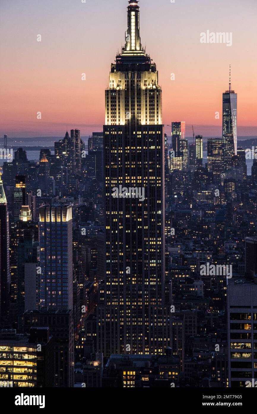 A vertical shot of the Empire State Building at sunset. Manhattan, New ...