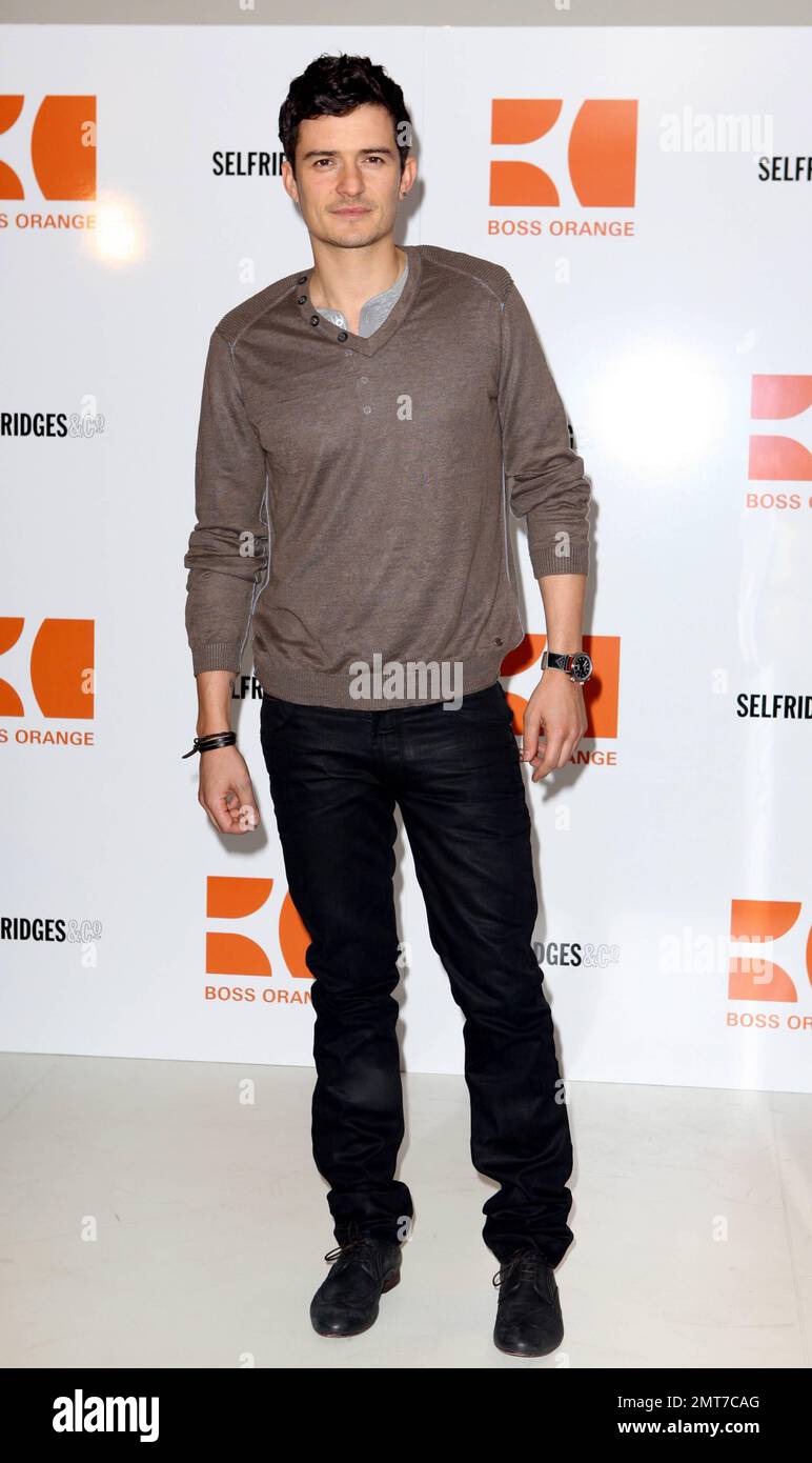 Orlando Bloom promotes the Hugo Boss fragrance Orange at Selfridge's in  London, UK. 3/17/11 Stock Photo - Alamy