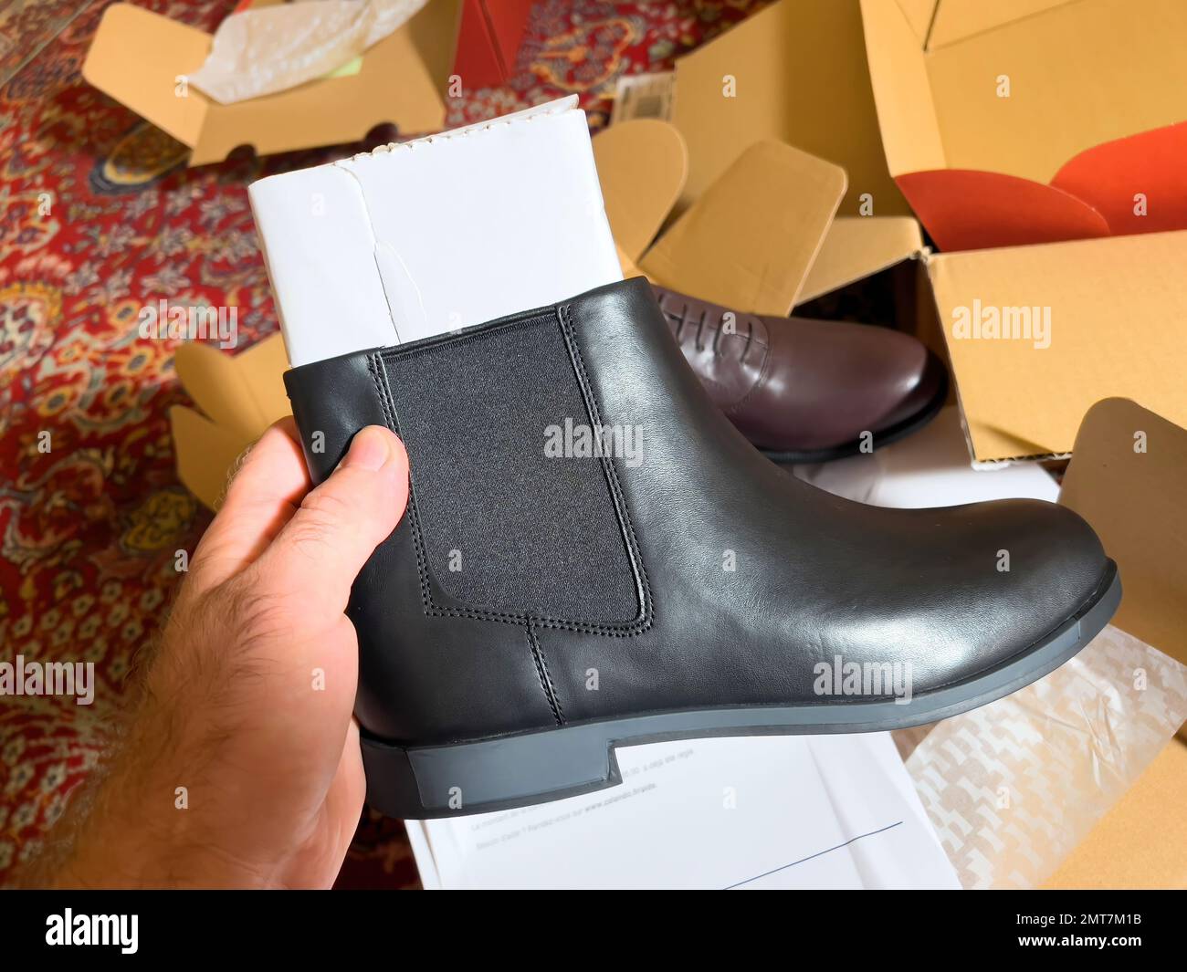 London, October 20, 2022: Personal perspective looking at the new brand  modern Camper leather cold weather ready shoes - manufactured by footwear  company with headquarters in Mallorca, Spain Stock Photo - Alamy