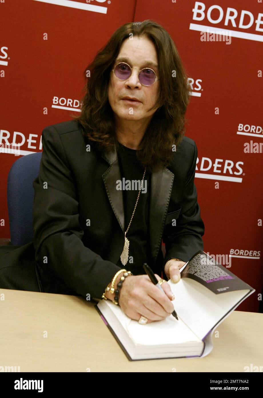 Ozzy Osbourne signs copies of his book "I Am Ozzy" at Borders Books in