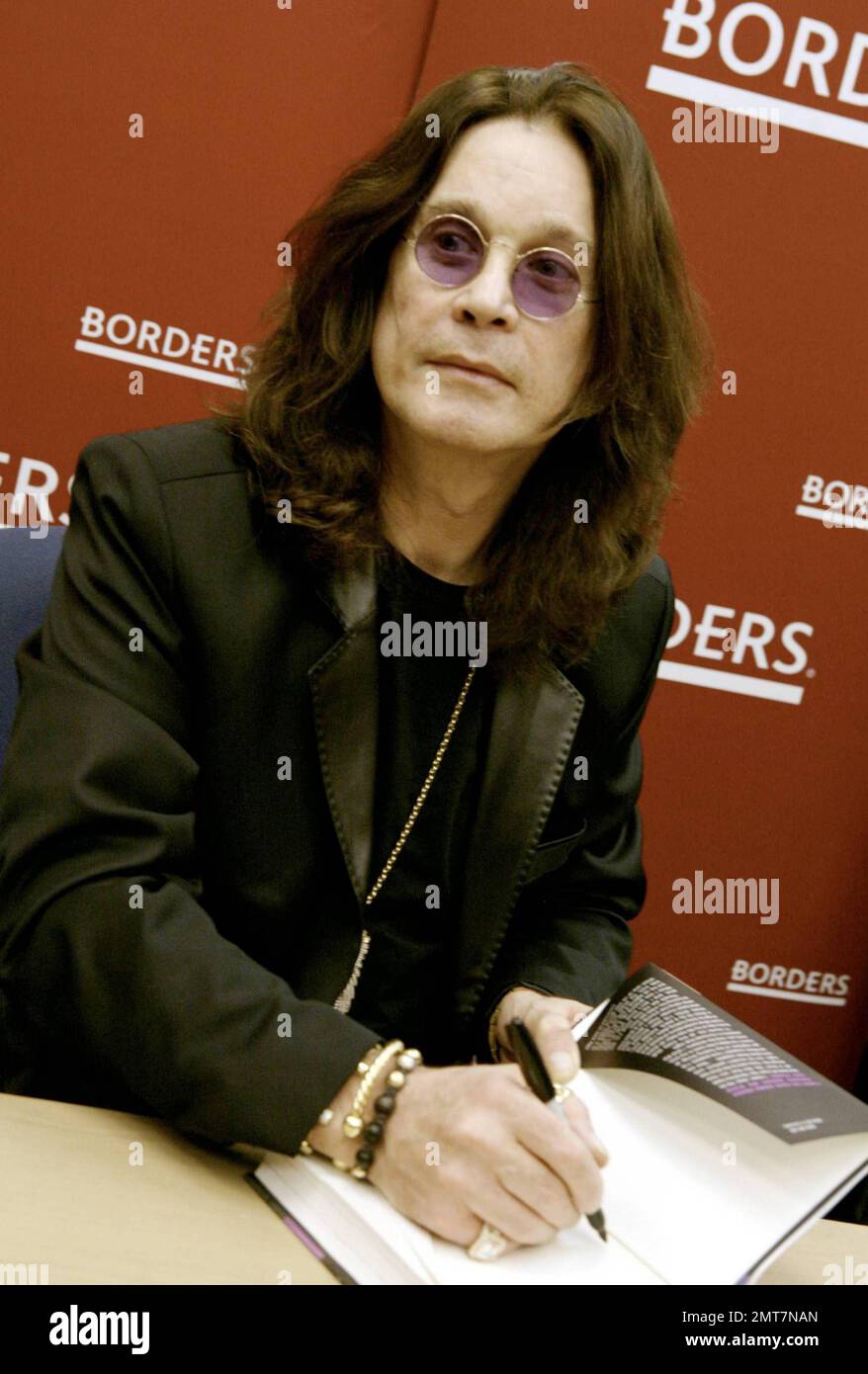 Ozzy Osbourne signs copies of his book "I Am Ozzy" at Borders Books in