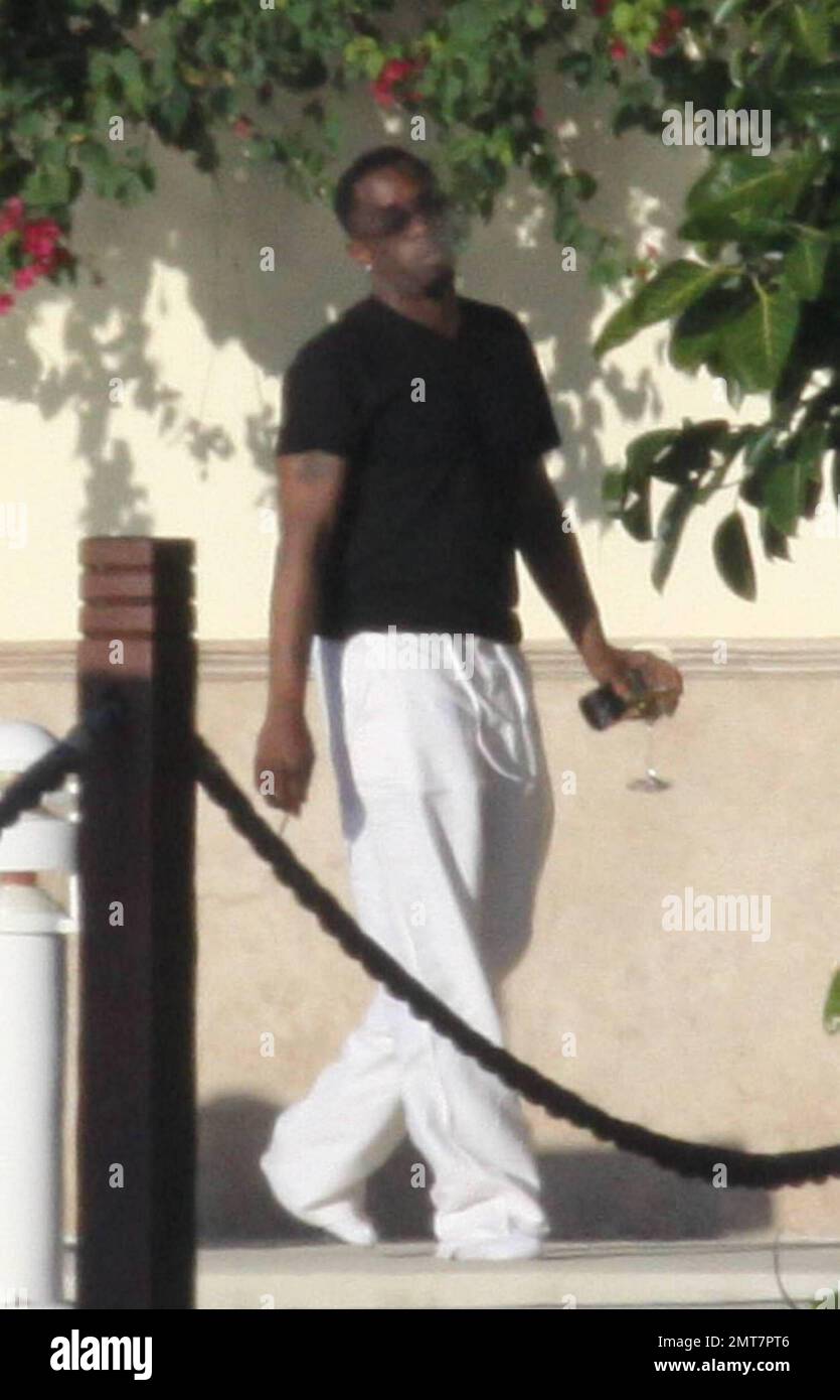 - EXCLUSIVE!! Hip Hop mogul Sean P Diddy Combs enjoys a glass of wine ...