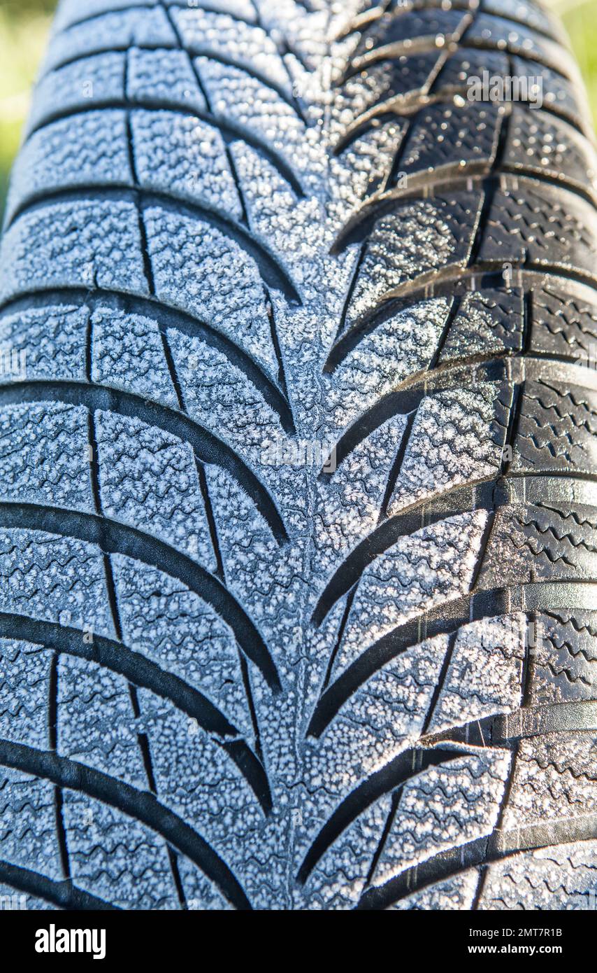 Frost covered tire surface. Safe driving on winter concept Stock Photo ... - Frost Asphalt Tire Change Guide
