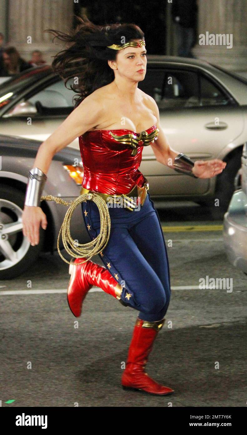 Adrianne Palicki dashes around set and shows off her figure in her iconic Wonder  Woman costume of a metallic red patent leather bustier top and blue  star-detailed leggings during overnight filming of