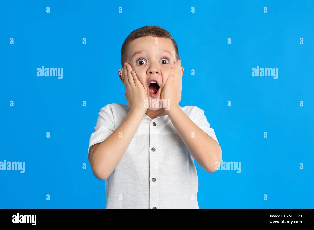Little boy on blue background hi-res stock photography and images - Alamy