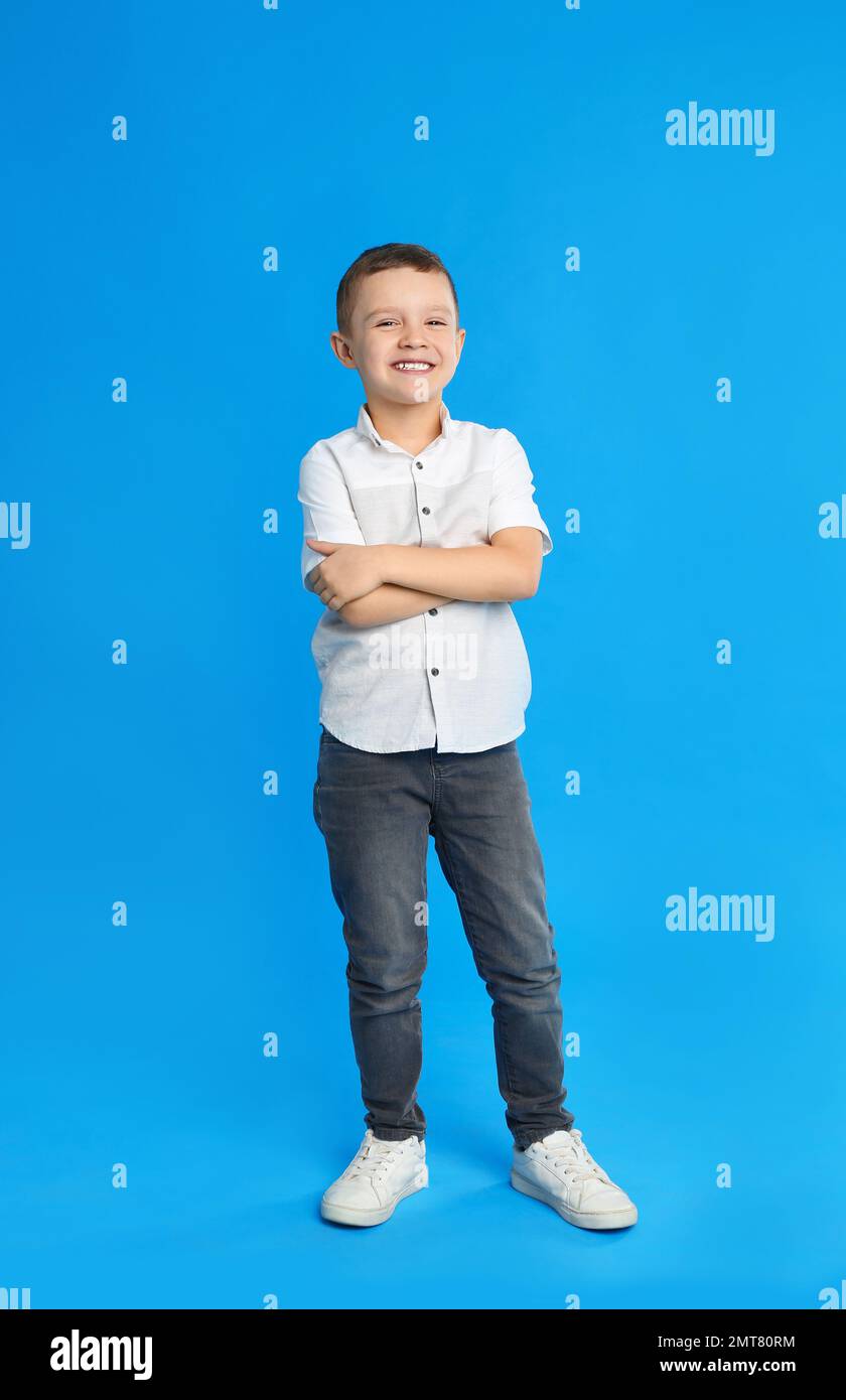 Portrait of cute little boy on blue background Stock Photo - Alamy