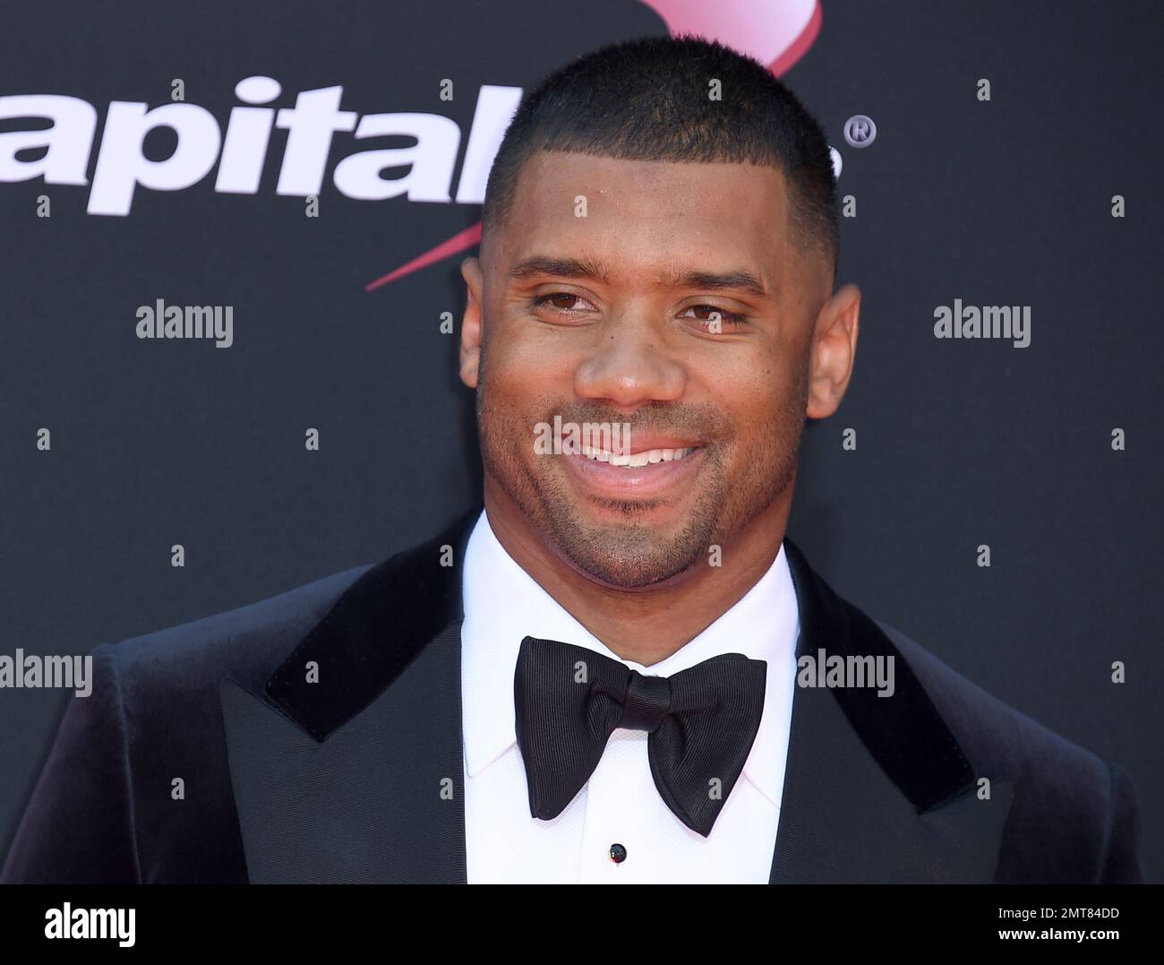 NFL football player Russell Wilson, of the Seattle Seahawks, arrives at