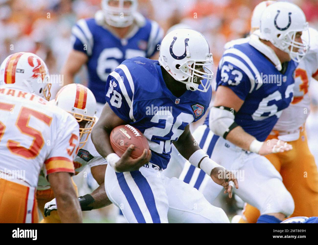 Indianapolis Colts running back Marshall Faulk (28) cuts through the Tampa  Bay Buccaneers defense during their game at Tampa Stadium, Sept. 11, 1994.  Faulk rushed for 104 yards and had 82 yards