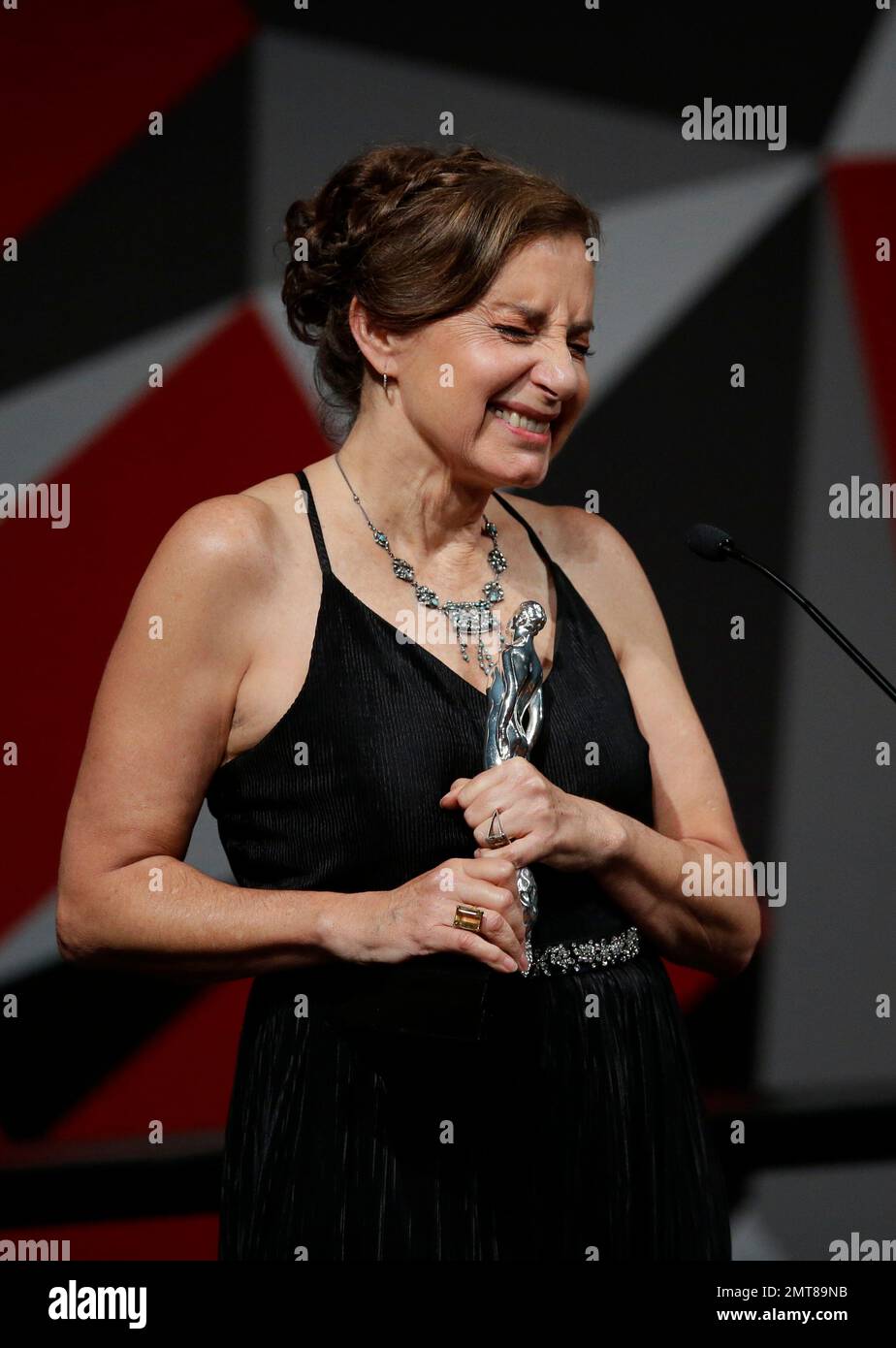 Veronica Langer reacts after winning best actress for "La caridad" during  the 59th Ariel Awards at the Palace of Fine Arts in Mexico City, Tuesday,  July 11, 2017. The Ariel Awards recognize