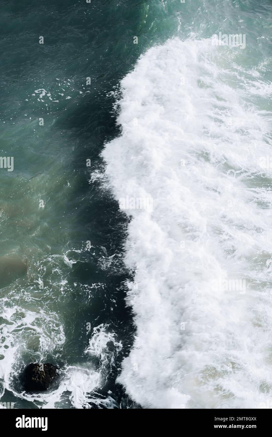 Vertical shot crashing waves hi-res stock photography and images - Alamy