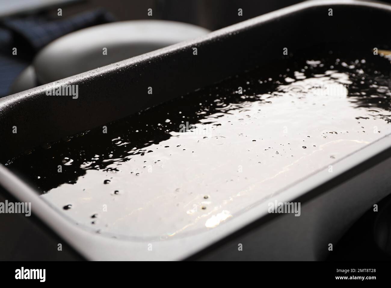 Hot cooking oil in deep fryer, closeup Stock Photo Alamy