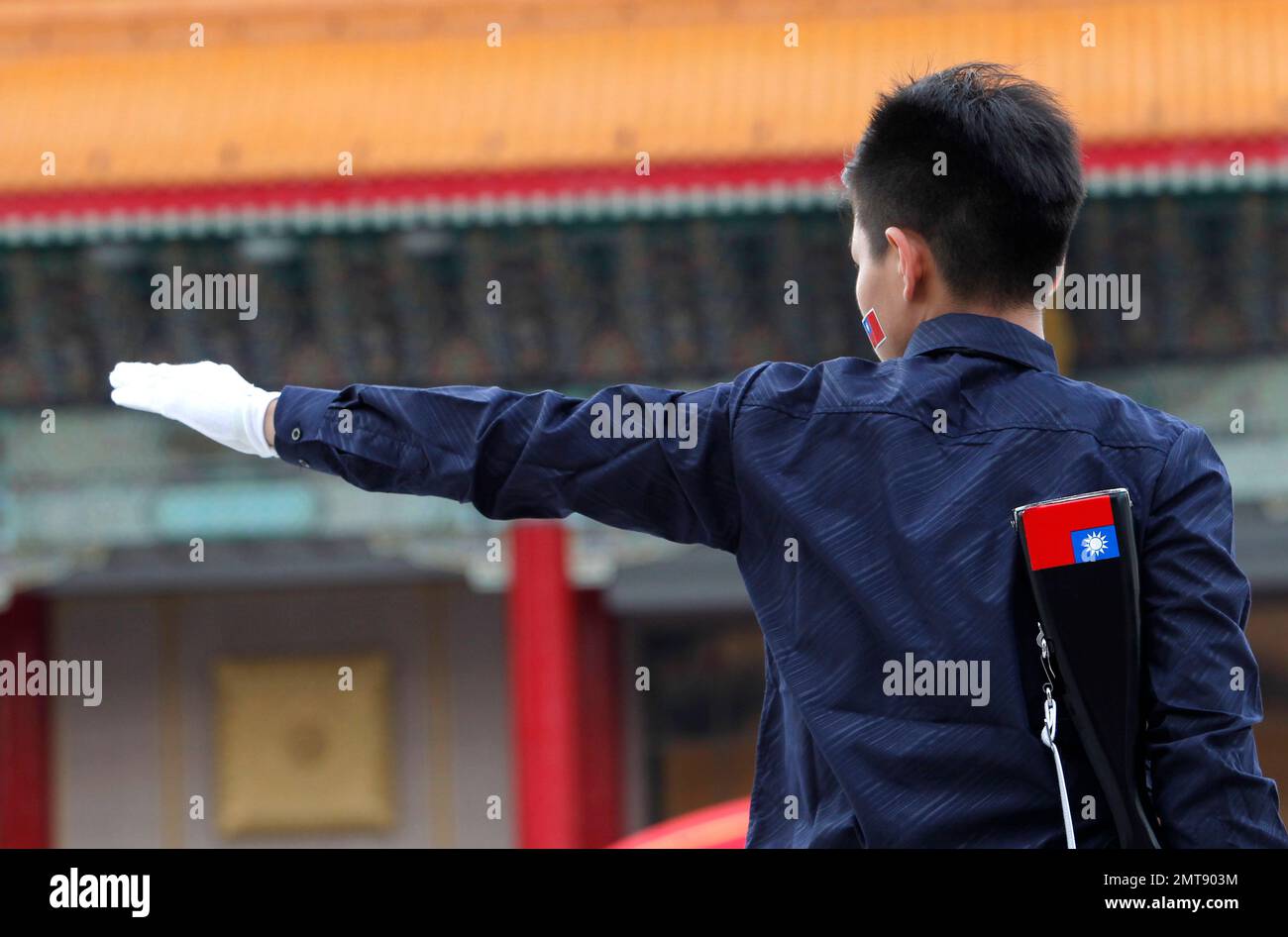 A senior high school student performs during the military honor guard ...