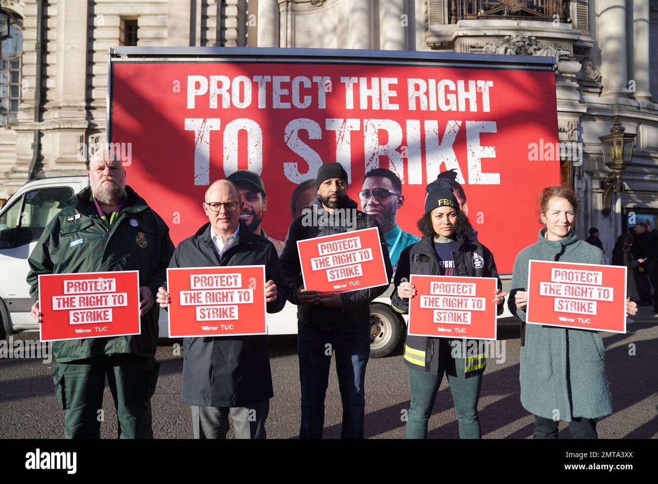 Paul Nowak(2nd-left), general secretary of the Trades Union Congress (TUC), joins union members as they gather outside Westminster Central Hall, in London, ahead of a march and rally against the Government's controversial plans for a new law on minimum service levels during strikes. Picture date: Wednesday February 1, 2023. Stock Photo