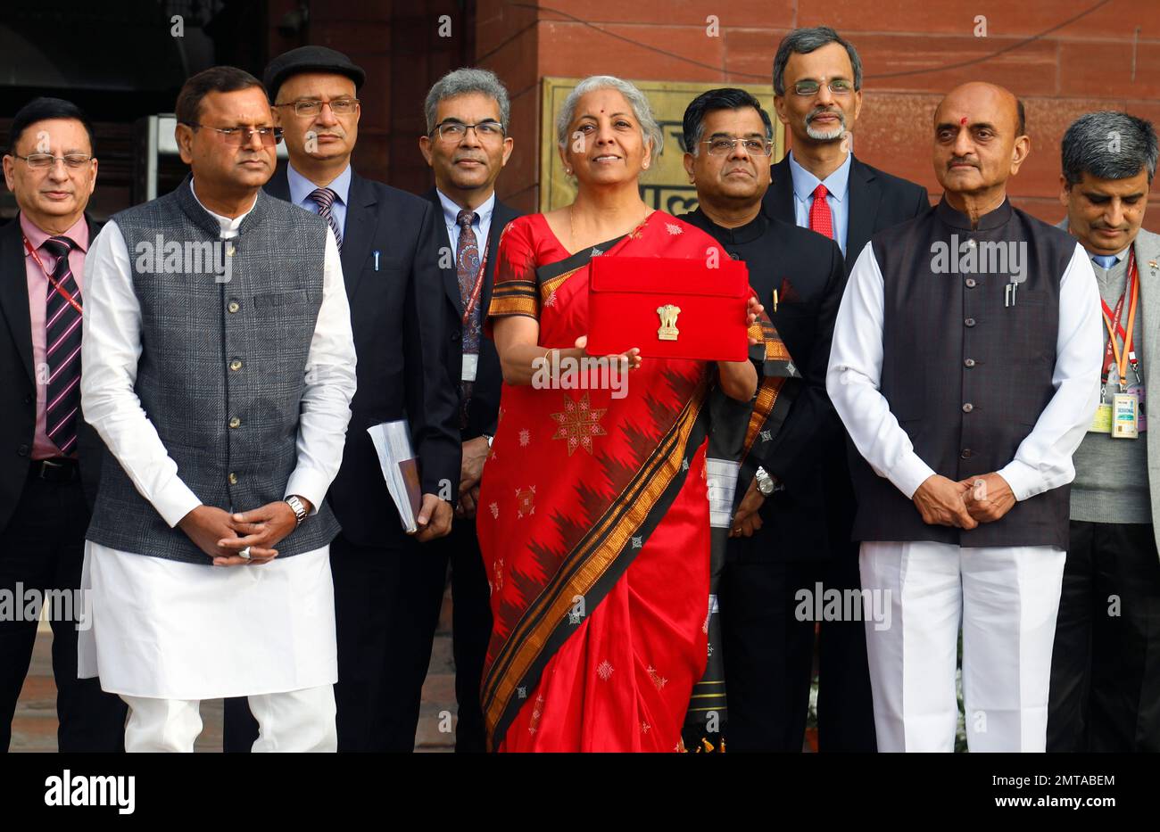 New Delhi, India. 01st Feb, 2023. Union Minister for Finance, Nirmala Sitharaman, Centre, Union Minister of Sate Bhagwat Kishanrao Karad, Right, and Pankaj Chaudhary, Left with other officials pose for photographs before she leaves her office (Finance Ministry), for the President's House before present the annual Budget for the year 2023-24 in the Parliament in New Delhi. Nirmala Sitharaman will be presenting her fifth union Budget. Credit: SOPA Images Limited/Alamy Live News Stock Photo