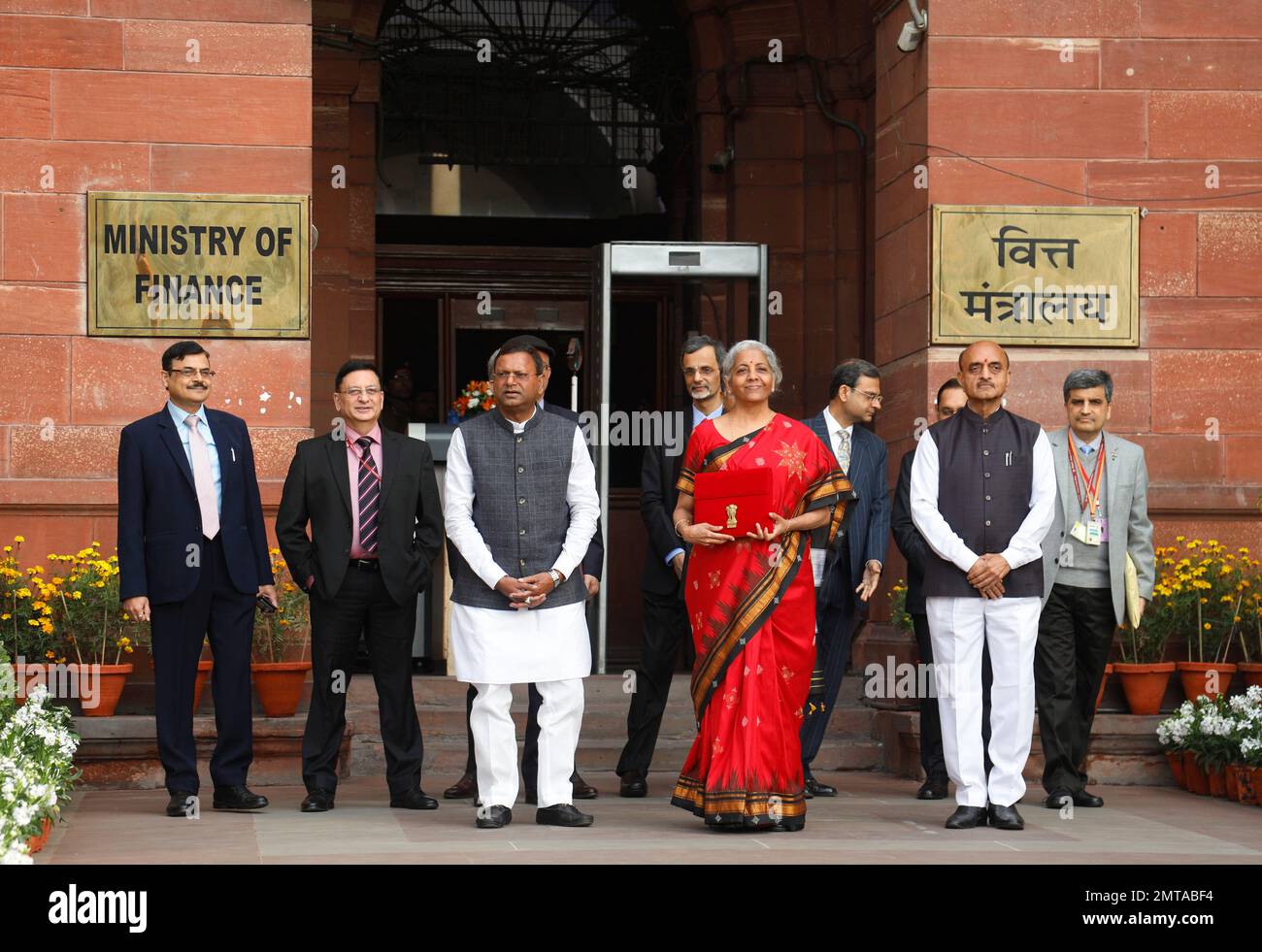 New Delhi, India. 01st Feb, 2023. Union Minister for Finance, Nirmala Sitharaman, Centre, Union Minister of Sate Bhagwat Kishanrao Karad, Right, and Pankaj Chaudhary, Left with other officials pose for photographs before she leaves her office (Finance Ministry), for the President's House before present the annual Budget for the year 2023-24 in the Parliament in New Delhi. Nirmala Sitharaman will be presenting her fifth union Budget. Credit: SOPA Images Limited/Alamy Live News Stock Photo