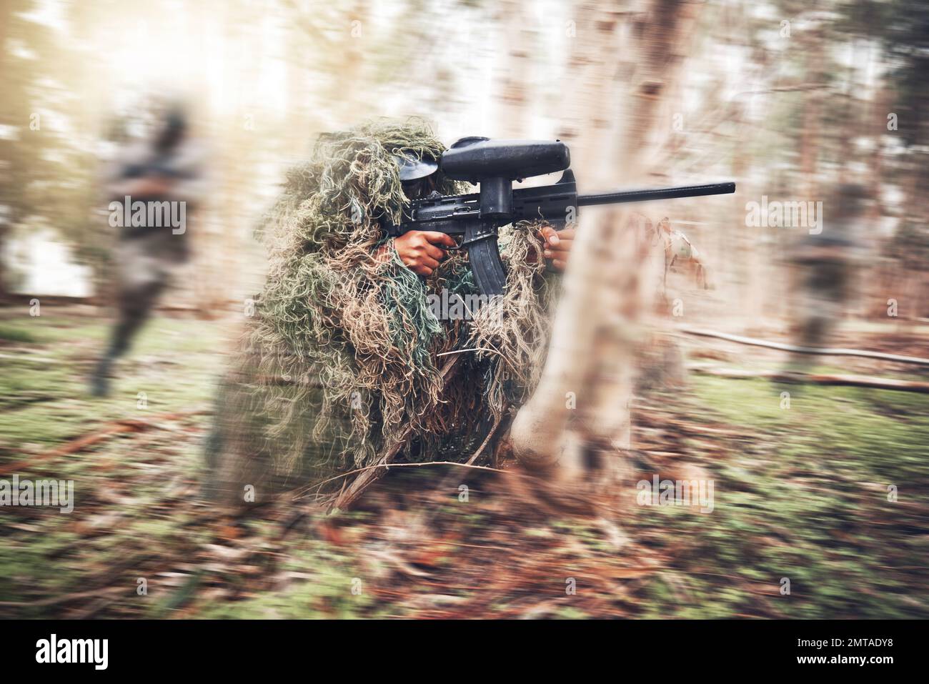 Paintball gun, woods and man with aim by trees for outdoor war game