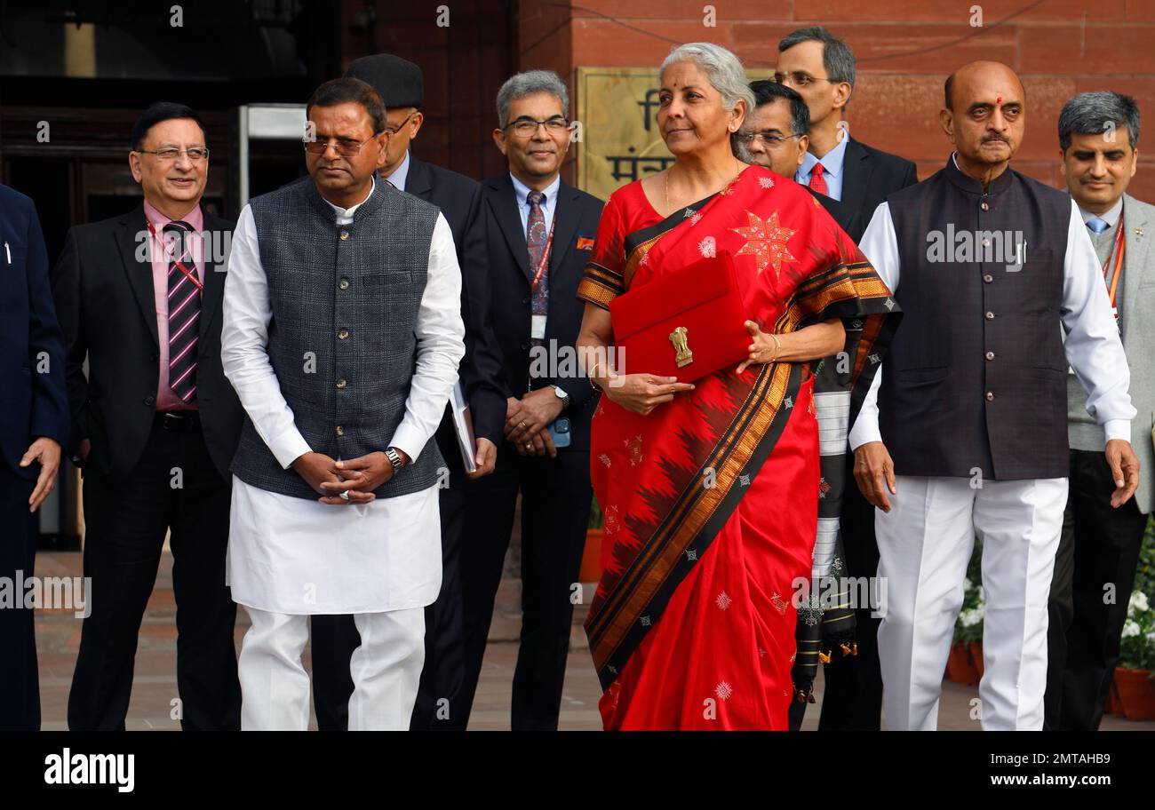 New Delhi, India. 01st Feb, 2023. Union Minister for Finance, Nirmala Sitharaman, Centre, Union Minister of Sate Bhagwat Kishanrao Karad, Right, and Pankaj Chaudhary, Left with other officials pose for photographs before she leaves her office (Finance Ministry), for the President's House before present the annual Budget for the year 2023-24 in the Parliament in New Delhi. Nirmala Sitharaman will be presenting her fifth union Budget. (Photo by Naveen Sharma/SOPA Images/Sipa USA) Credit: Sipa USA/Alamy Live News Stock Photo
