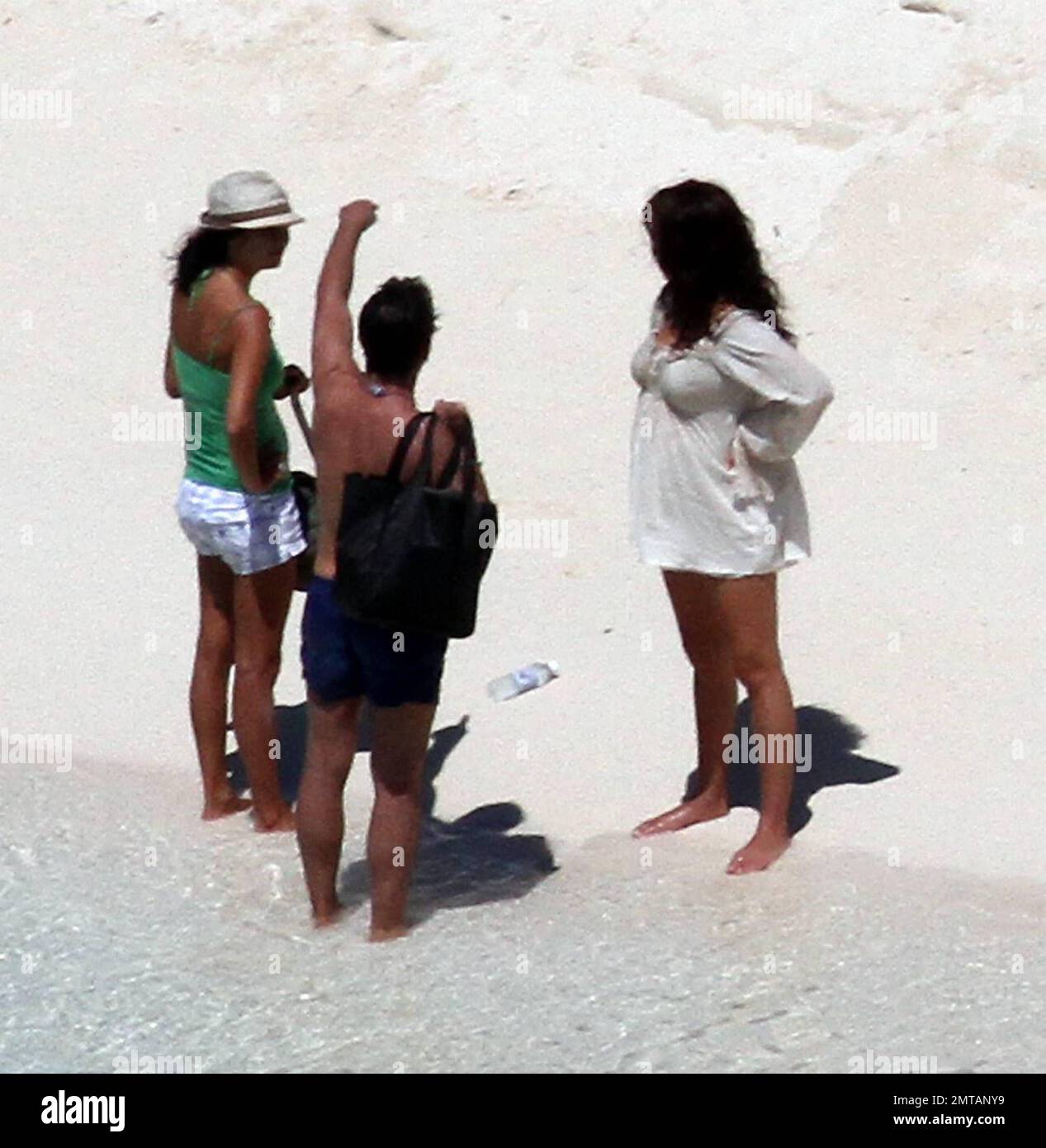 EXCLUSIVE!! Penelope Cruz is seen barefoot on a deserted island beach