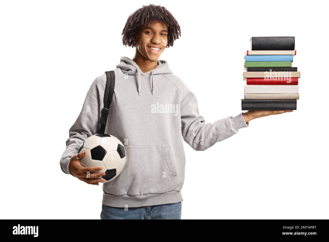 Male african american student with a backpack holding a pile of books ...