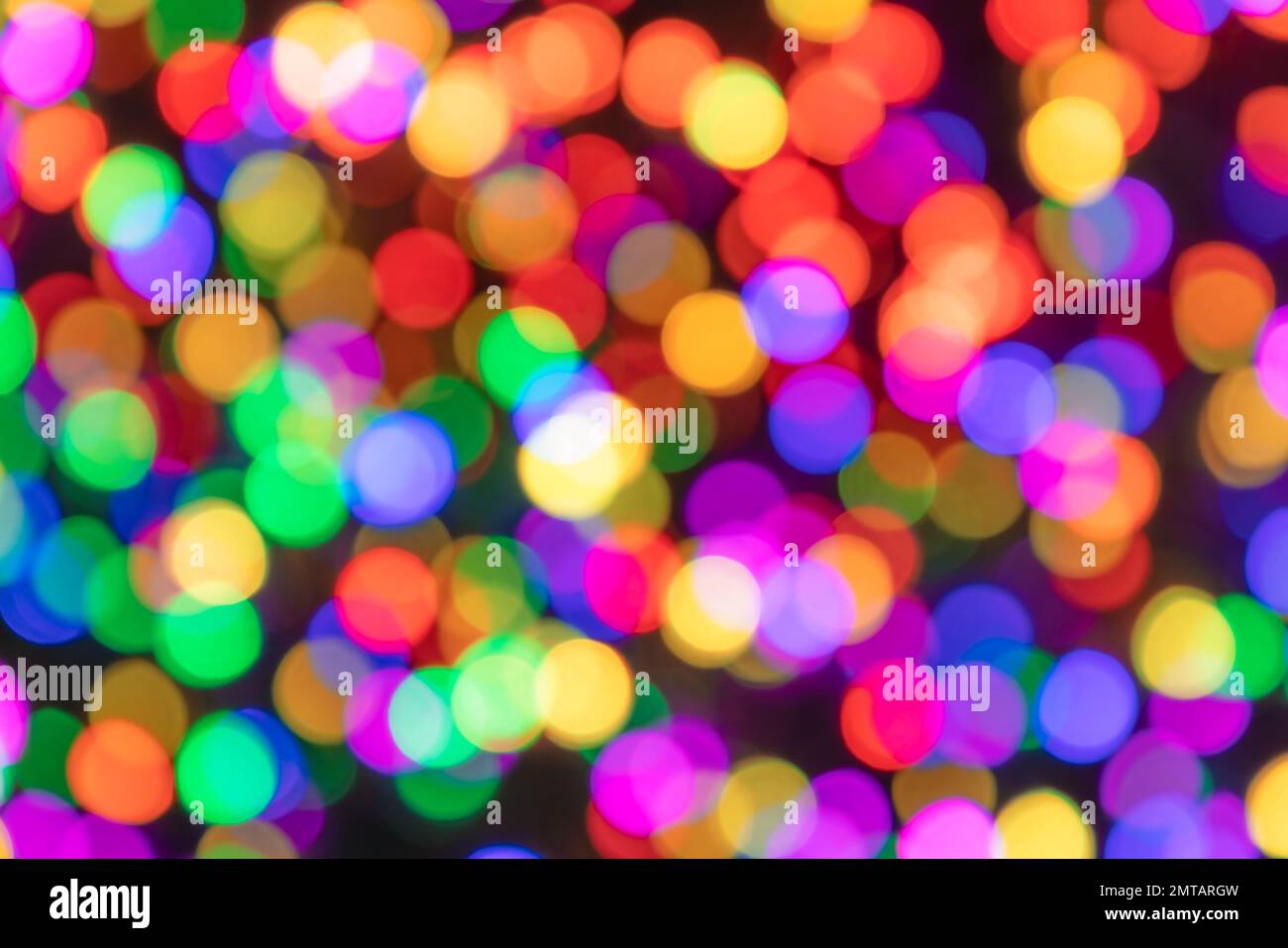 Multicolored blurred circles of light on a dark background with bokeh effect Stock Photo Alamy