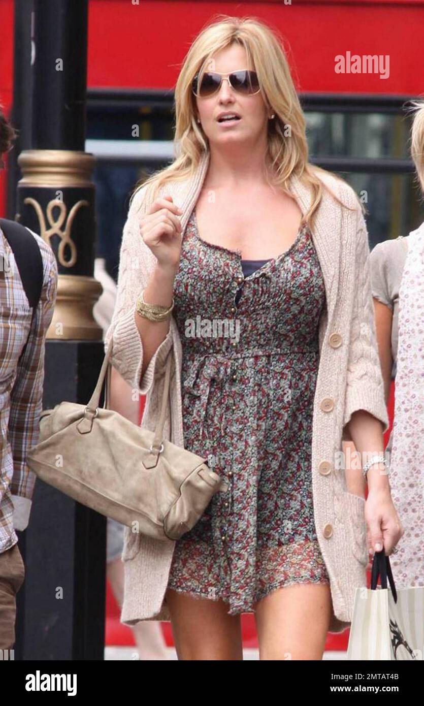 EXCLUSIVE!! Penny Lancaster, third wife of veteran singer Rod Stewart, appears to be reading a hand drawn map as she and some friends make their way to World Hair Colourist of the Year Daniel Galvin's hair salon in London the day after her husband performed at the O2 Arena.  Penny, 39, seemed to walk confidently in her sheer floral mini dress and tan cowboy boots paired with a matching cardigan and handbag. London, UK. 07/29/10.    . Stock Photo