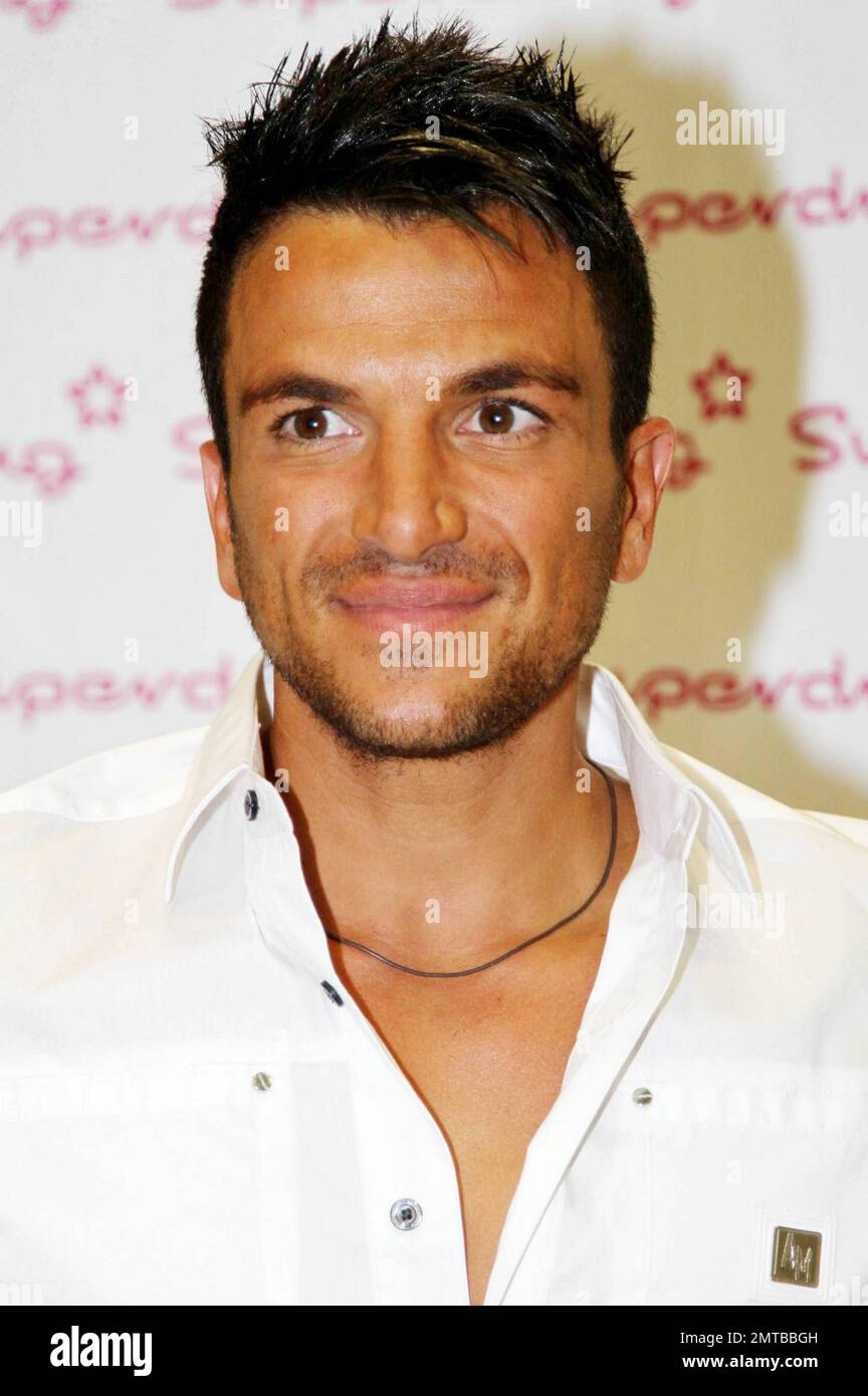 Pop singer Peter Andre poses with a bottle of his new fragrance ...