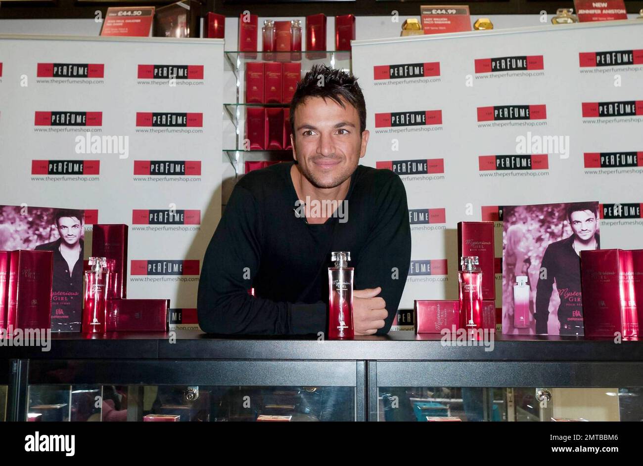 After a quick shirt change and half hour drive, singer and reality TV star Peter Andre appears at The Perfume Shop in Elms Shopping Centre in High Wycombe for an autograph session, launching his new fragrance for women, Mysterious Girl.  Earlier in the day Peter attended a photo call at The Chimes Shopping Centre in Uxbridge.  And while Peter has been busy maintaining his musical and merchandise career, ex-wife Katie Price appears to have been nurturing her new husband Alex Reid's professional mixed martial arts fighting career; she was seen ringside cheering Alex on last week during his UFC B Stock Photo