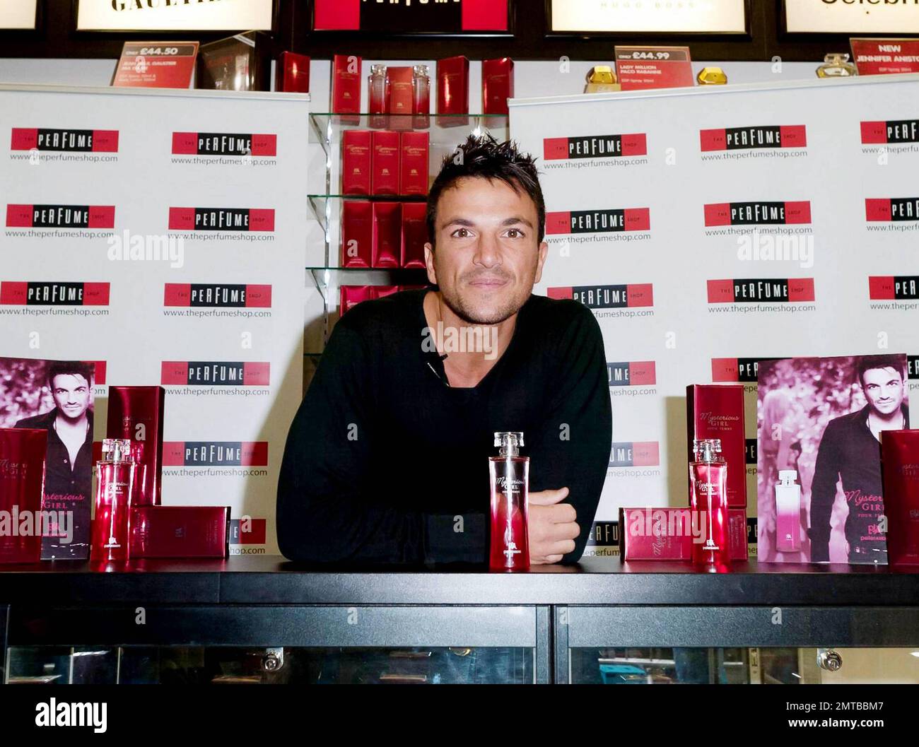 After a quick shirt change and half hour drive, singer and reality TV star Peter Andre appears at The Perfume Shop in Elms Shopping Centre in High Wycombe for an autograph session, launching his new fragrance for women, Mysterious Girl.  Earlier in the day Peter attended a photo call at The Chimes Shopping Centre in Uxbridge.  And while Peter has been busy maintaining his musical and merchandise career, ex-wife Katie Price appears to have been nurturing her new husband Alex Reid's professional mixed martial arts fighting career; she was seen ringside cheering Alex on last week during his UFC B Stock Photo