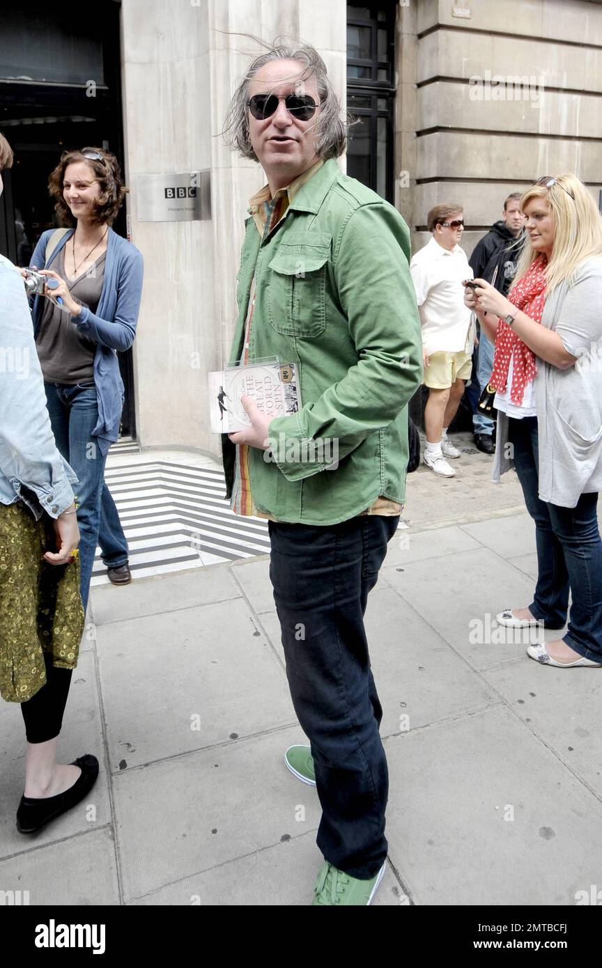 REM guitarist Peter Buck wears a green shirt and matching green shoes