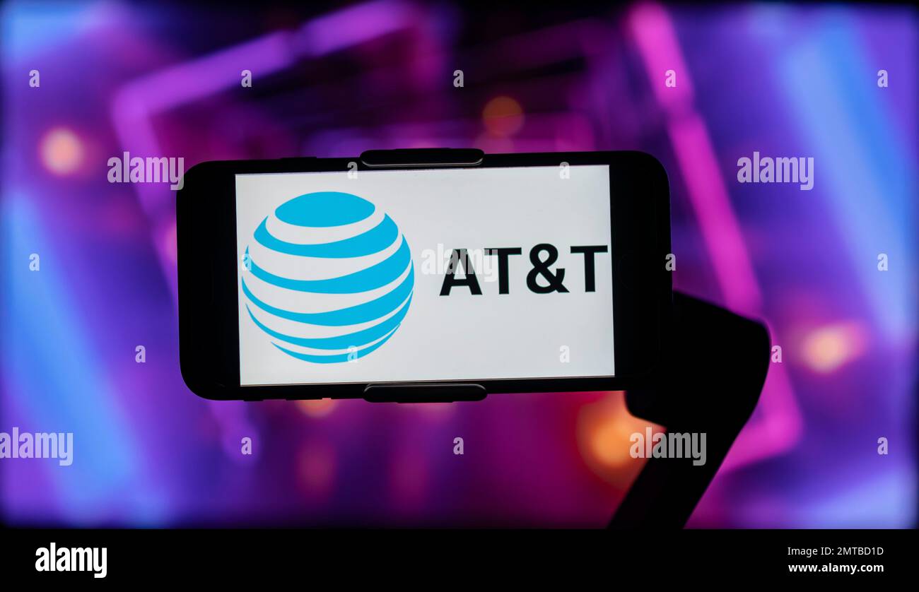 In this photo illustration, the logo of AT&T seen displayed on a mobile ...