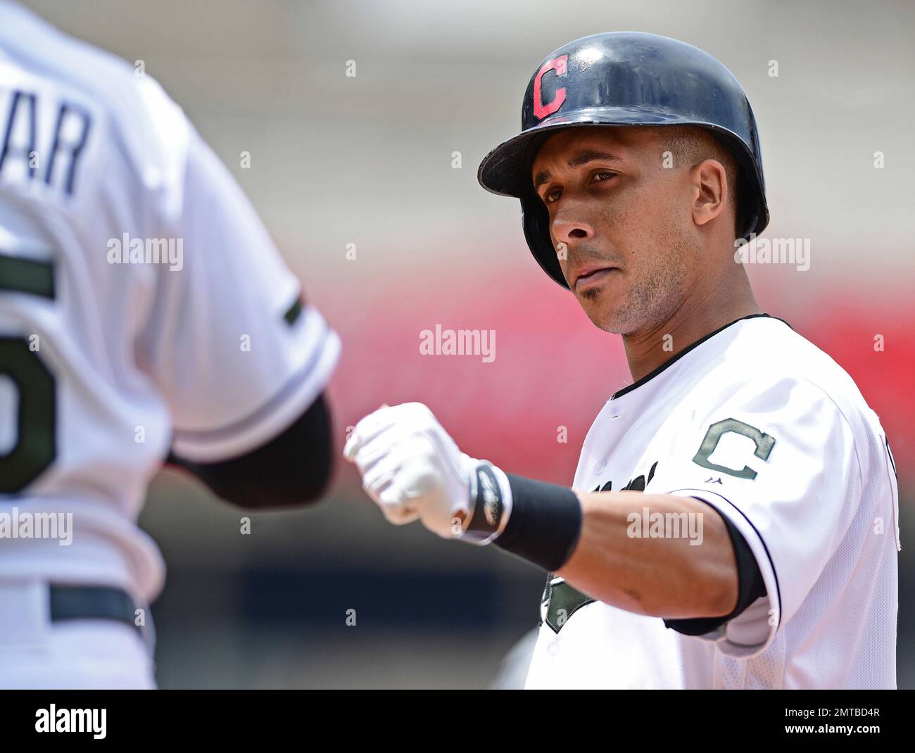 Milwaukee, WI, USA. 9th May, 2018. Cleveland Indians center fielder Tyler  Naquin #30 is congratulated by Cleveland Indians left fielder Michael  Brantley #23 and Cleveland Indians first baseman Yonder Alonso #17 after