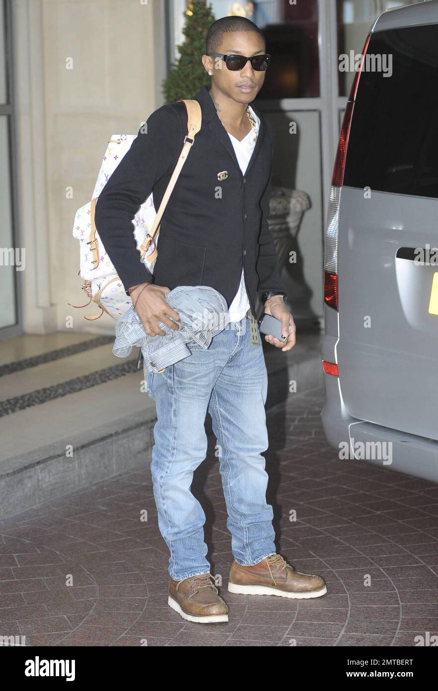 American musician Pharrell Williams of the hip hop and funk band N.E.R.D  leaves his London hotel. Pharrell, 37, is in town to perform with N.E.R.D  during their European tour. Also noted as
