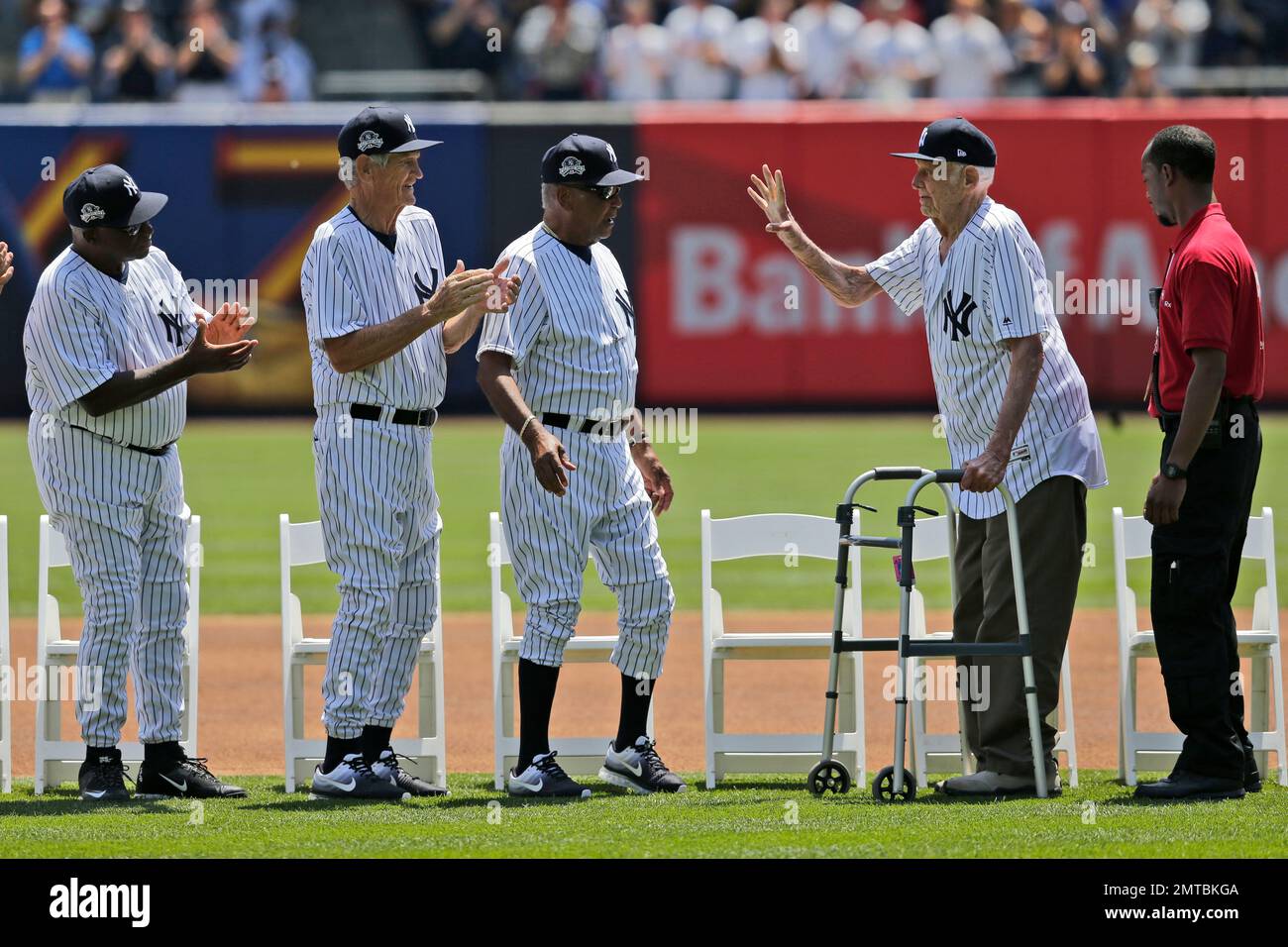 Former New York Yankee Don Larson, second from right, waves during Old