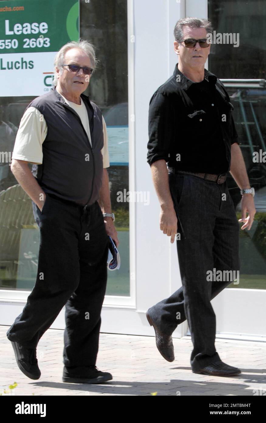 EXCLUSIVE!! Actor Pierce Brosnan walks with a friend at the Cross Creek