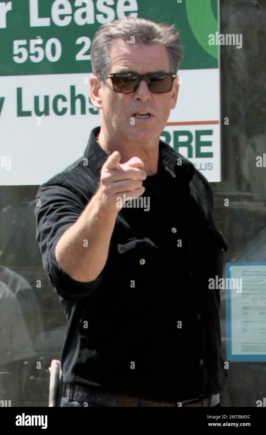 EXCLUSIVE!! Actor Pierce Brosnan walks with a friend at the Cross Creek