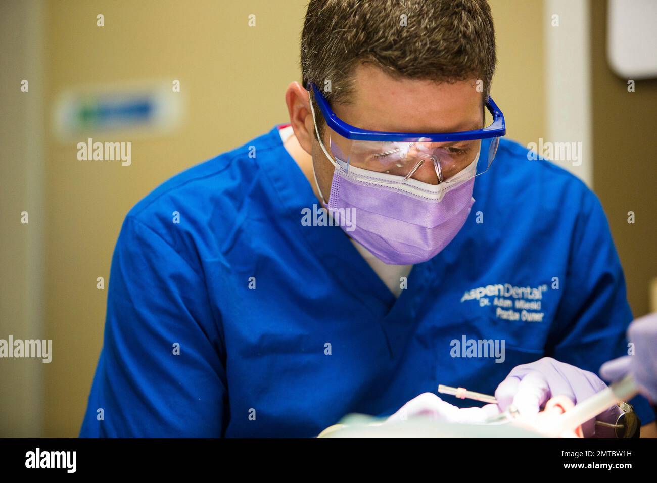 IMAGE DISTRIBUTED FOR ASPEN DENTAL Dr. Adam Mileski provides dental